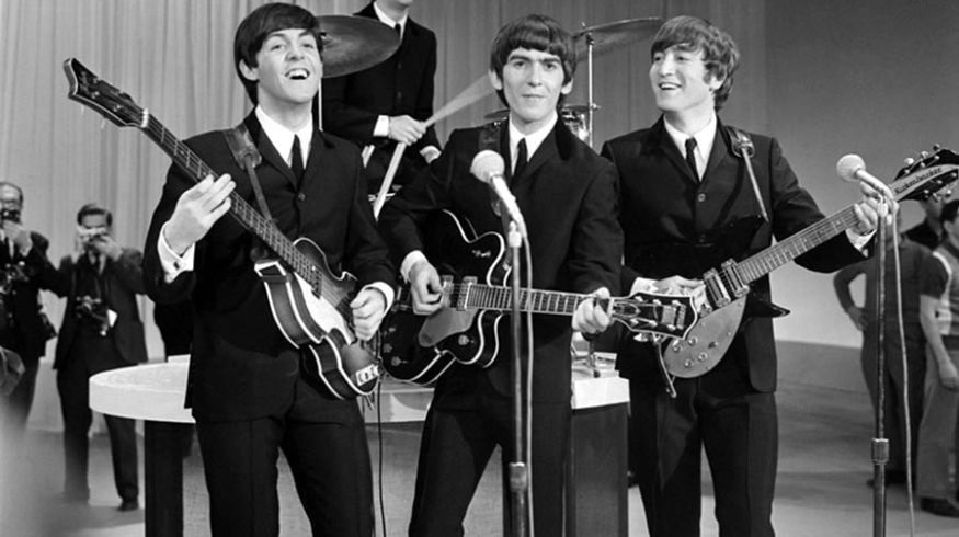 Agrupación los Beatles durante una actuación.